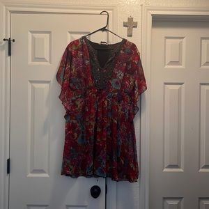 This is a boutique dress in excellent condition.